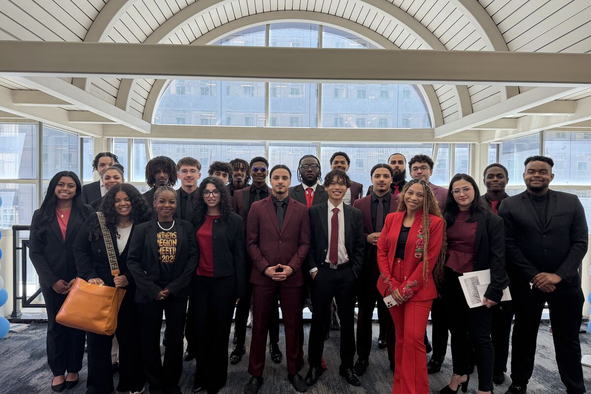 The Lorem, Inc team in business attire at a company event