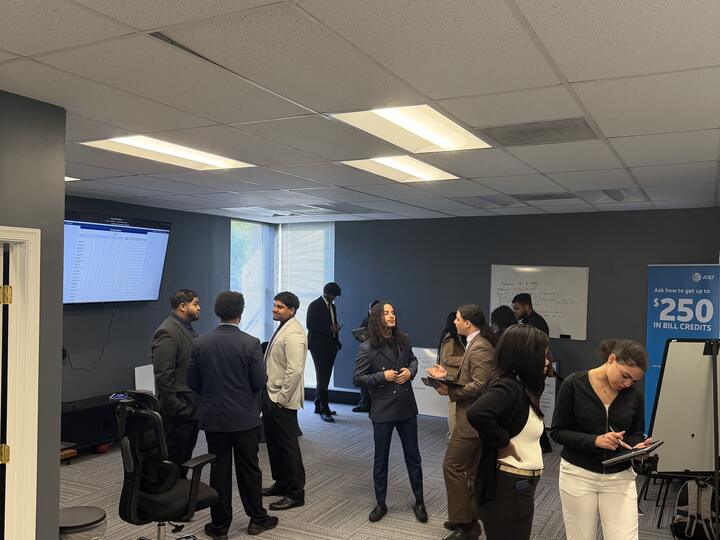 Lorem, Inc team members networking at an office event