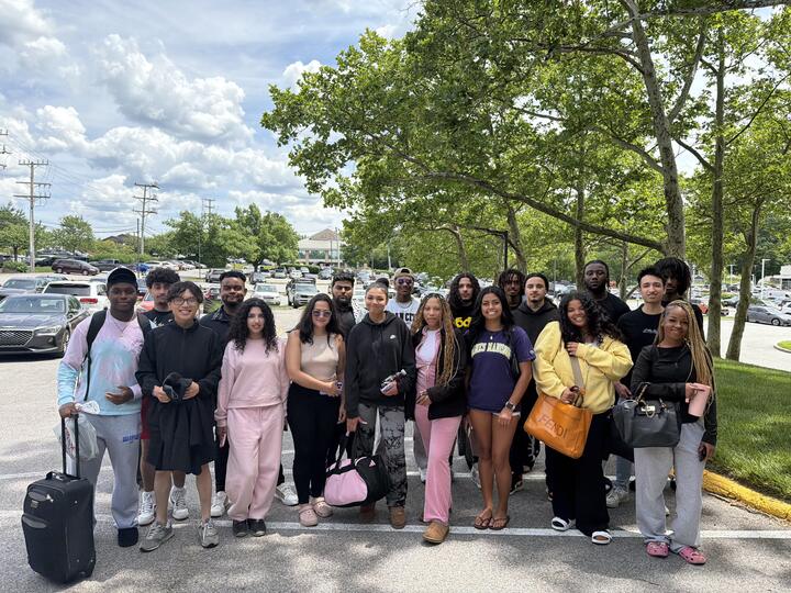 Lorem, Inc team gathered outdoors before a group trip
